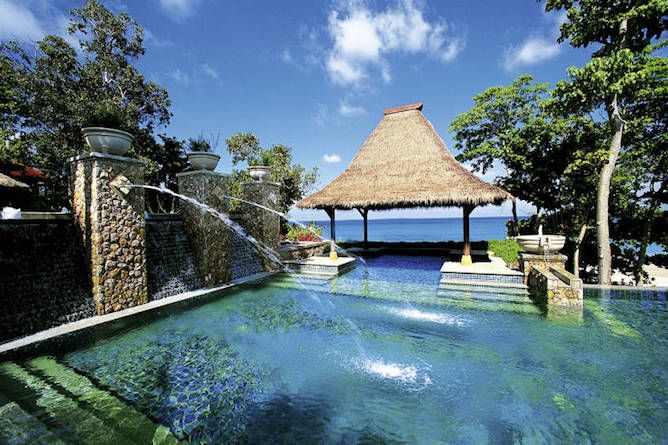 The hotel pool with views down to the beach and ocean