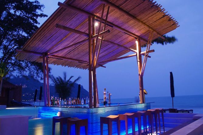 Swim-up pool bar at dusk