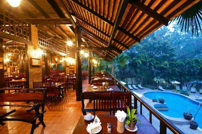 Hotel restaurant with views over the pool and towards the river