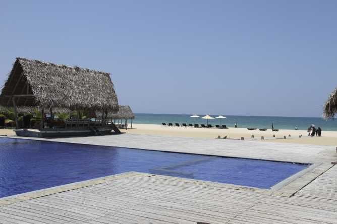 Infinity pool with beach views