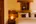 a bed with a wood headboard and a lamp