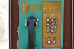 a public telephone on a wall