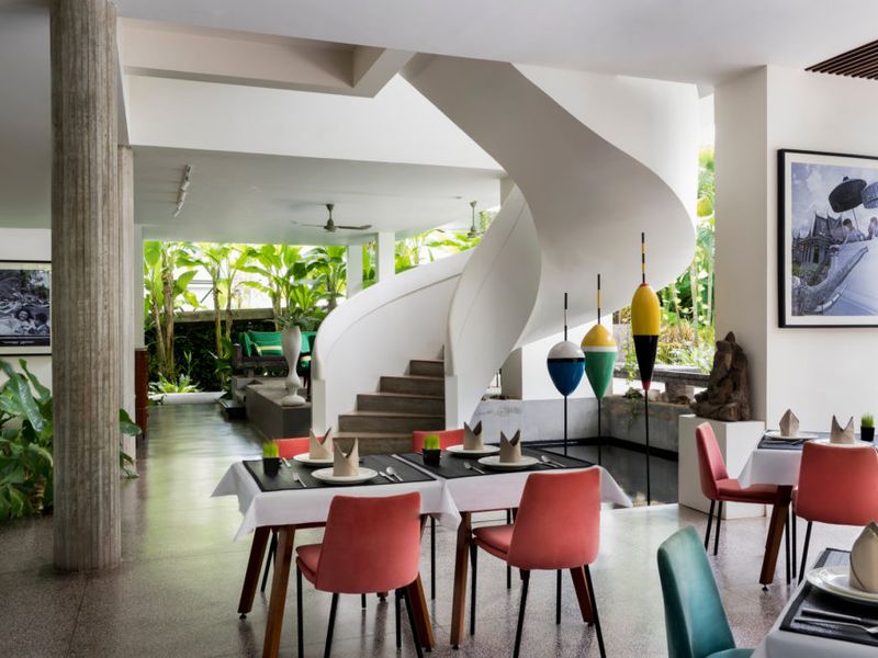 Dining room with spiral staircase at Viroth's Hotel