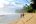 a man and woman walking on a beach