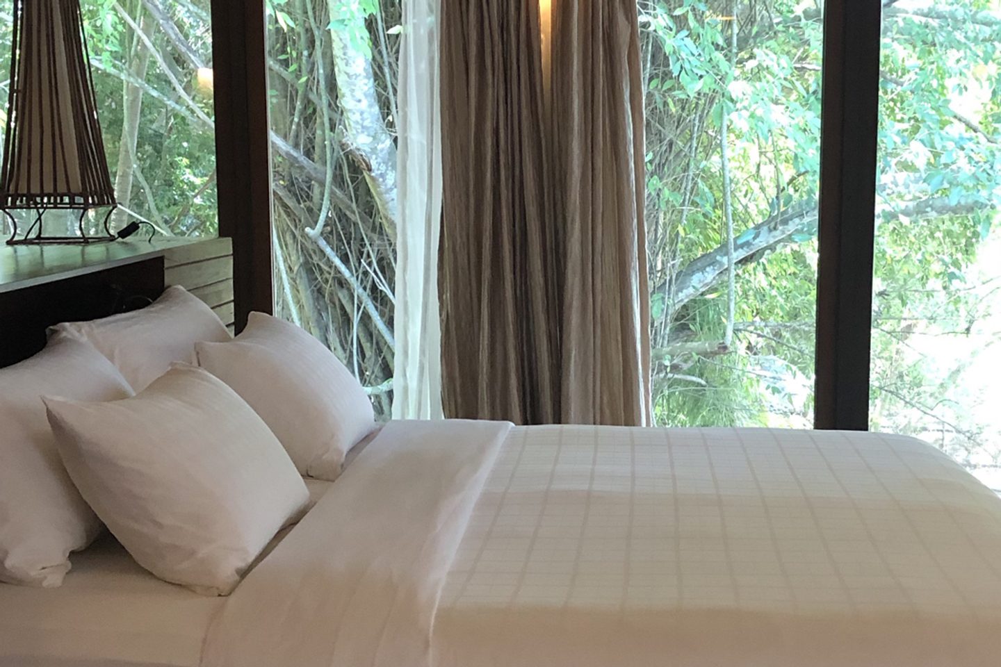 Bedroom with jungle views at Japamala Resort