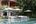 Pool with loungers at Knai Bang Chatt