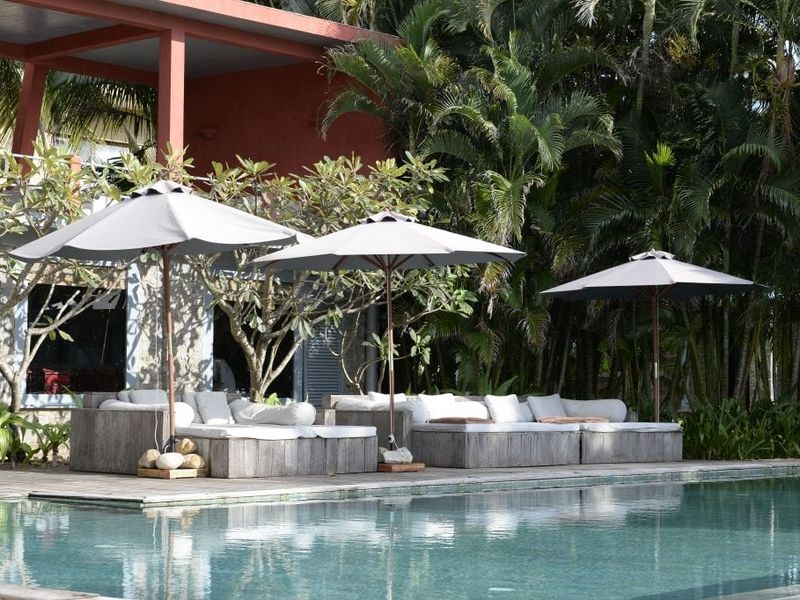 Pool with loungers at Knai Bang Chatt
