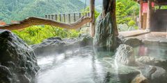 a hot spring with rocks and water