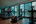 a room with treadmills and people running