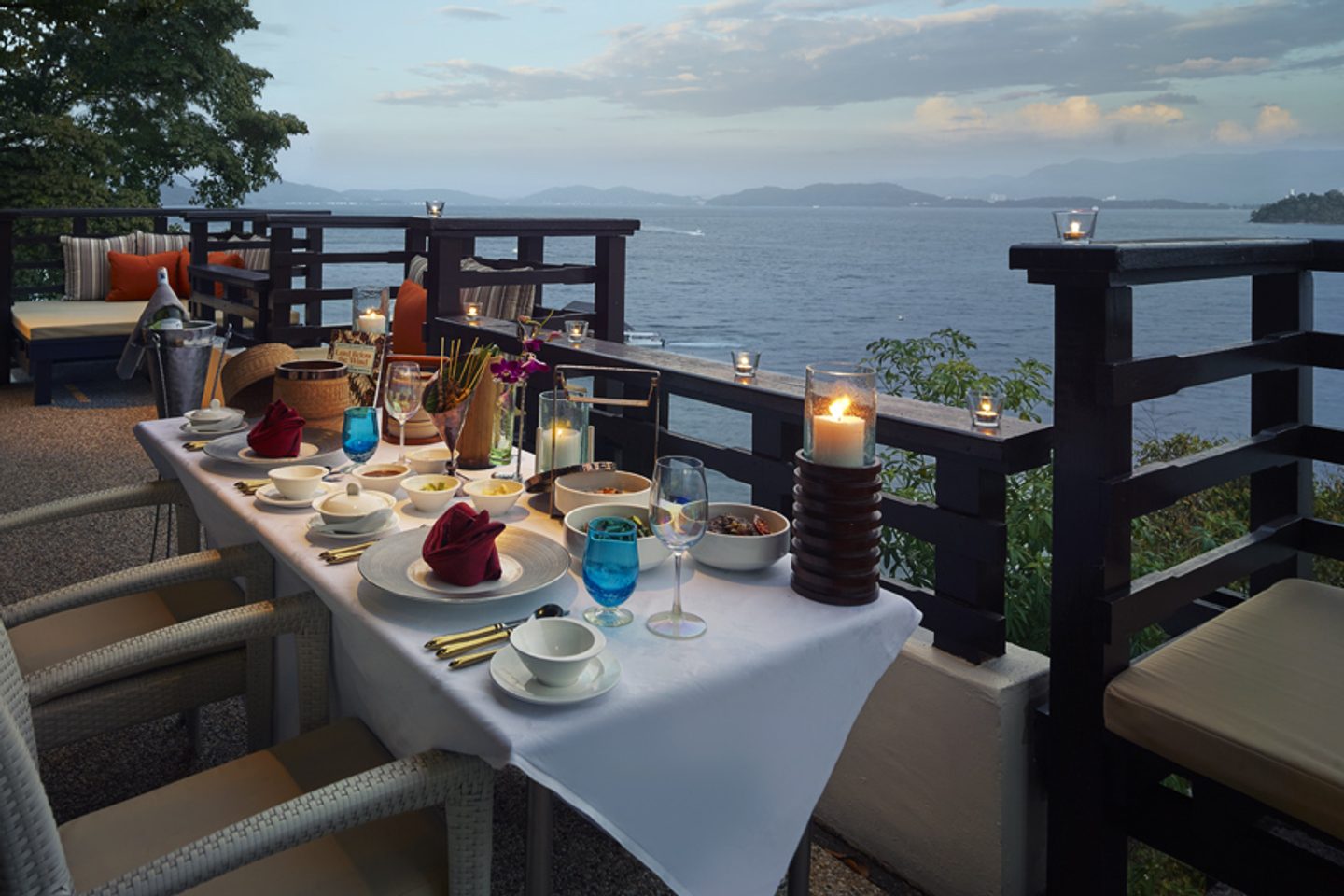 Table overlooking the sea at sunset at Gaya Island Resort