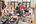 a group of people cooking in a kitchen