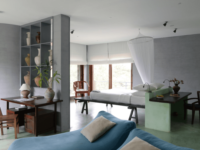 Bedroom and seating area at Knai Bang Chatt