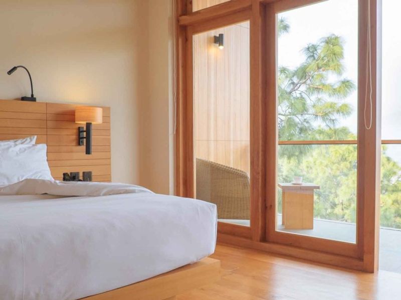 Bedroom with balcony at Dhensa Boutique Resort