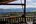 a view of mountains from a porch