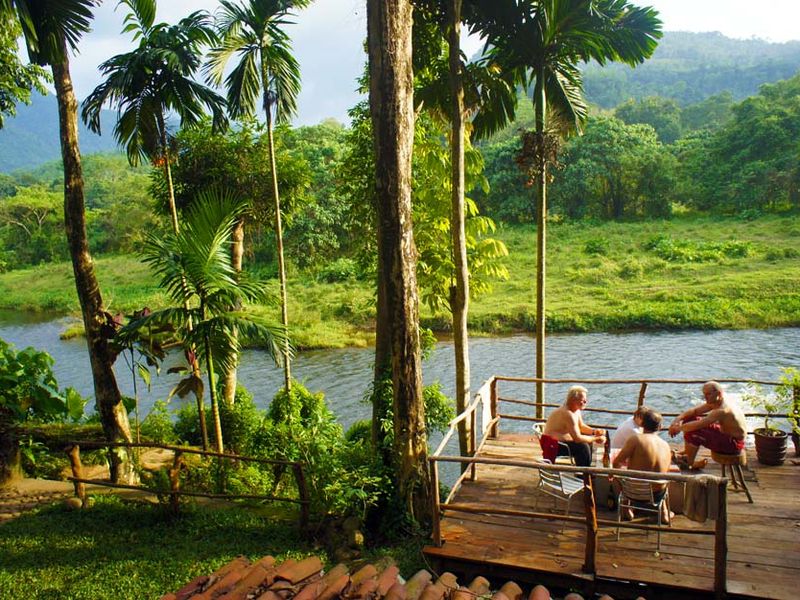 Terrace overlooking river at Borderlands Camp