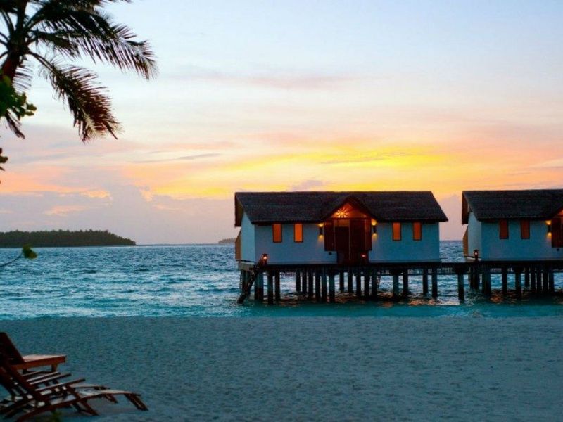 Villas at sunset at Reethi Beach
