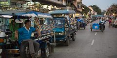 a man sitting on a vehicle