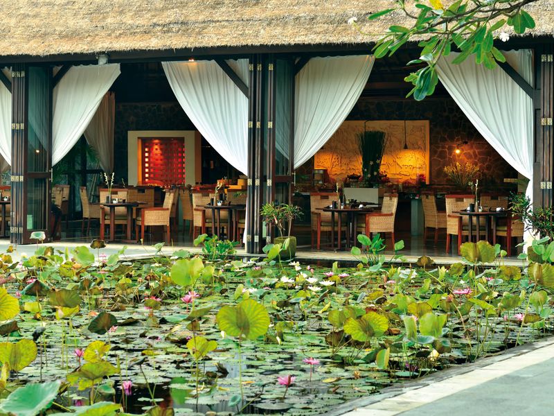 Restaurant overlooking pond at Belmond Jimbaran Puri Bali Indonesia