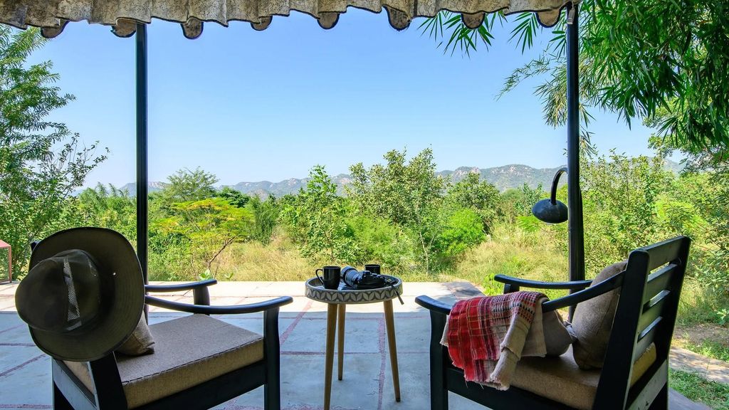 Chairs and table overlooking landscape