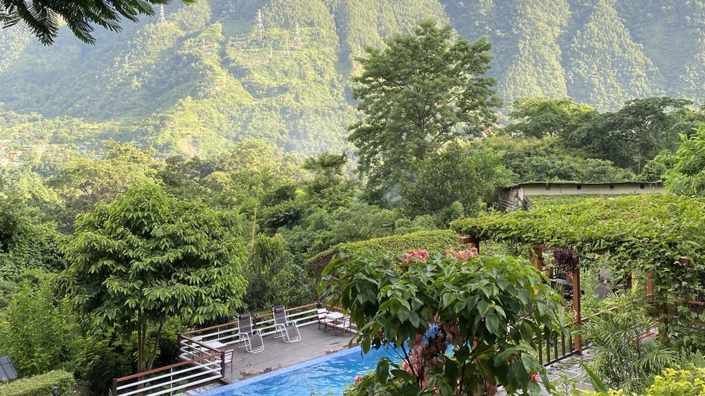 Outdoor pool with views over the hillside at Summit River Lodge