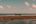 Man standing on a boat in the shallows near Rote Island Timor Indonesia