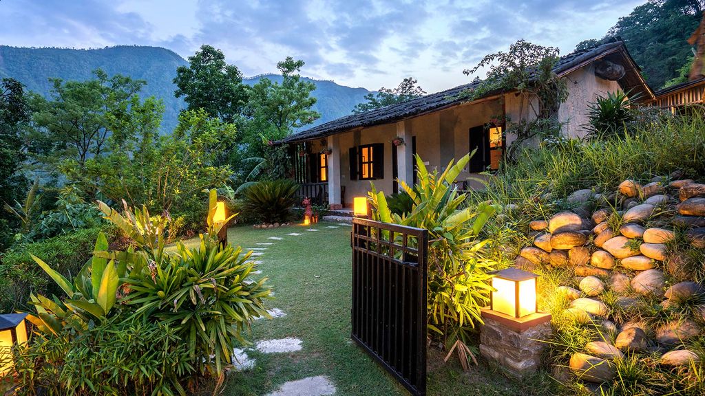 Lodge and garden by twilight at Summit River Lodge