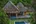 a house with a pool in the middle of it
