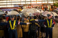 a group of people holding umbrellas