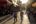people walking on a sidewalk