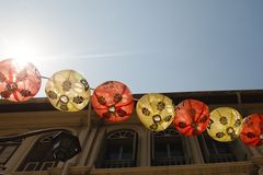 a row of lanterns on a building