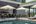 a pool with umbrellas and chairs