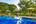 a pool with umbrellas and chairs