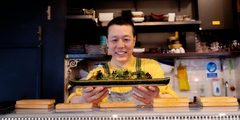 a man holding a plate of food