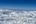 aerial view of snowy mountains and clouds