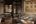 a room with a large table and a bed