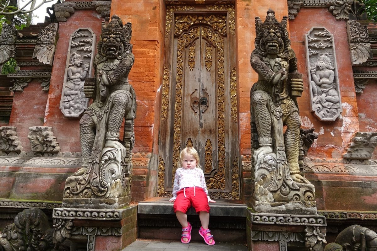 Child sitting on temple steps
