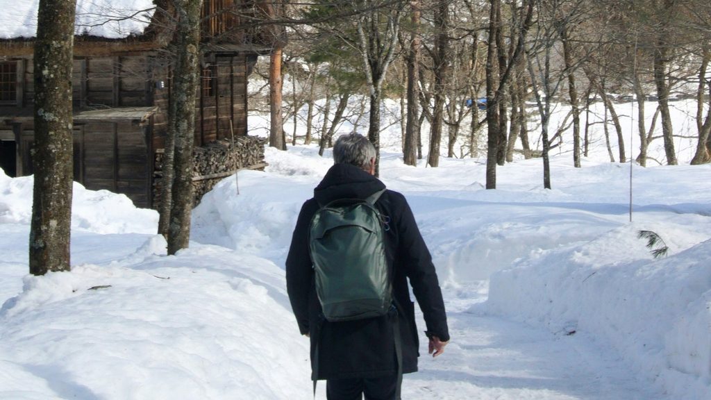 Man walking through snow in Japan