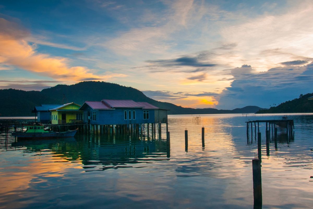 Stilted houses at sunset Riau islands