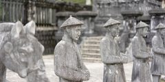 a group of statues of men