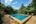Outdoor pool at Maisons Wat Kor