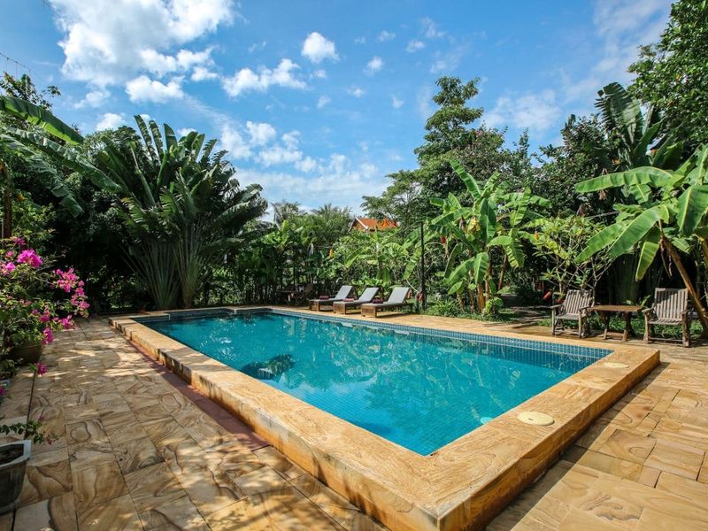 Outdoor pool at Maisons Wat Kor