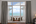 a room with a balcony overlooking the ocean