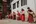 a group of people wearing red and orange robes