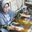 a woman painting a picture