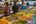 a group of people in a food market