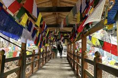 a bridge with colorful flags