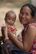 a woman holding a baby