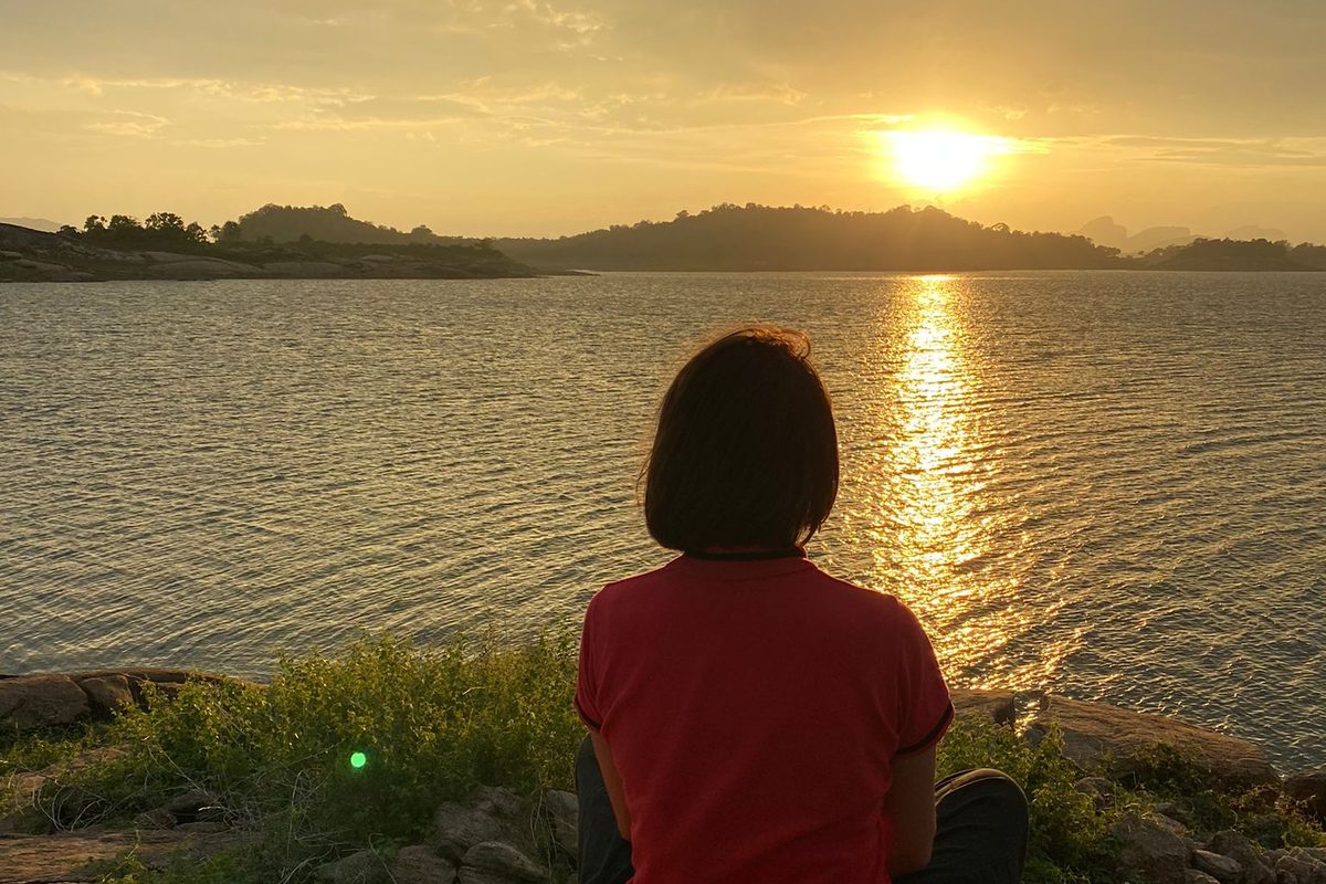 Woman looking at sunset