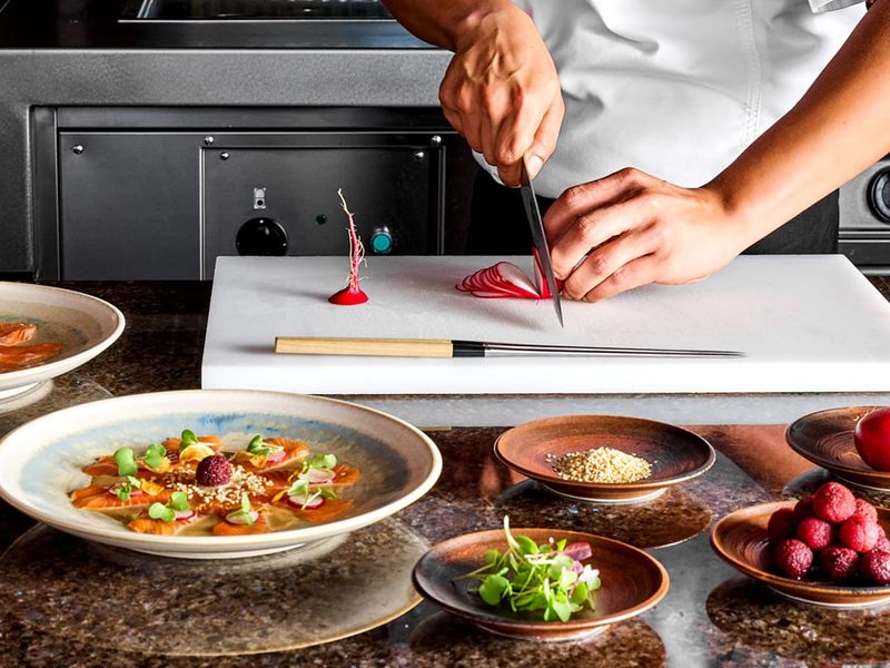 Chef preparing food at Joali Maldives