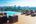 a deck with chairs and a pool